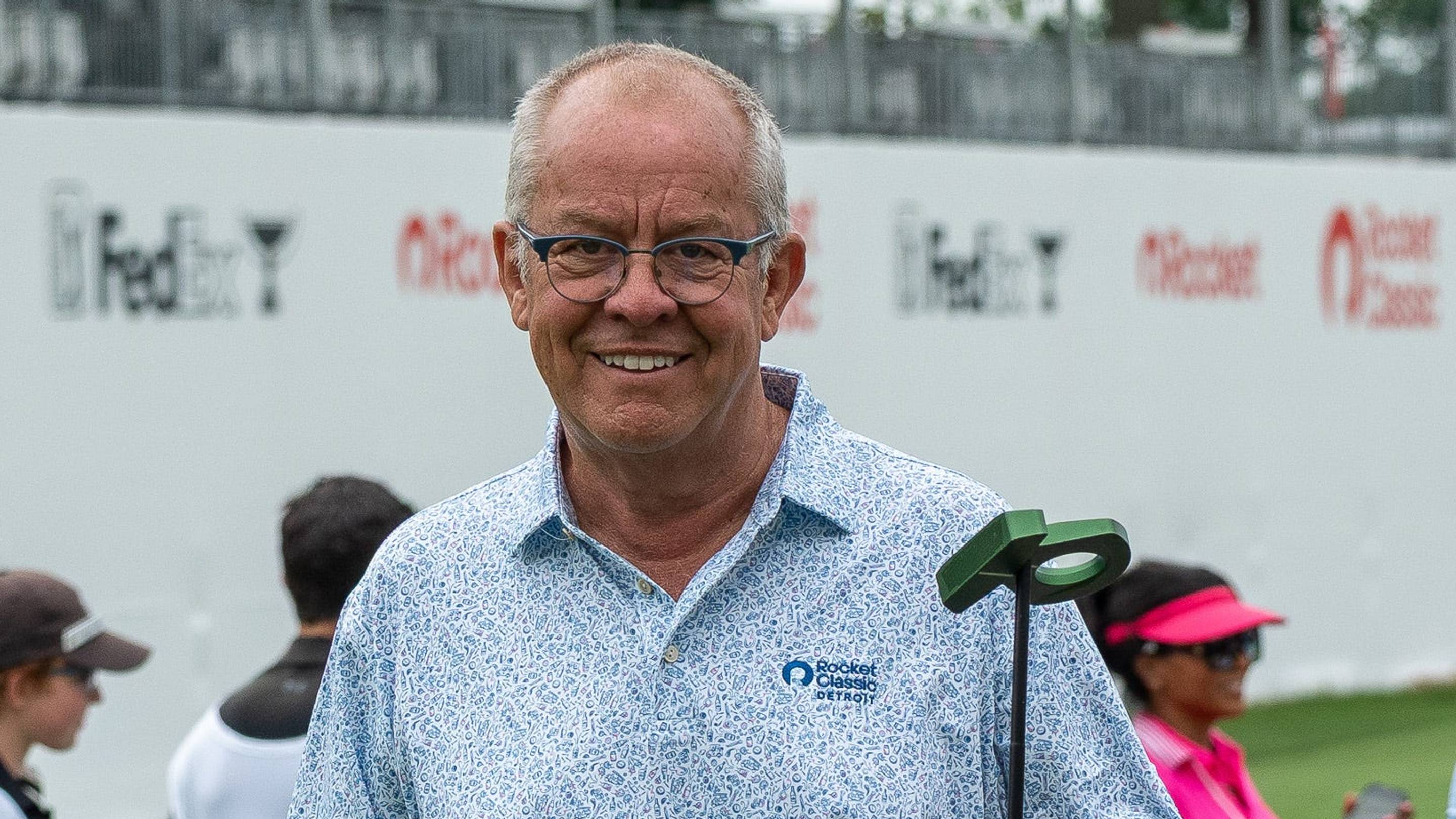 Mark Hollis, CEO of Rock Ventures Sports & Entertainment, smiles as he puts away his putter during the Rocket Classic Pro-Am in Detroit on Wednesday, June 25, 2025.