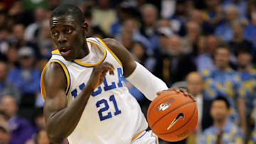 March 12, 2009; Los Angeles, CA, USA; UCLA Bruins guard Jrue Holiday (21) moves the ball up court against the Washington State Cougars during the first half of the quarterfinals of the Pac-10 tournament at Staples Center. Mandatory Credit: Gary A. Vasquez-Imagn Images