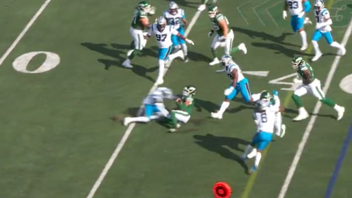 Justin Fields got hit hard by Panthers safety Nick Scott. Justin Fields got hit hard by Panthers safety Nick Scott.