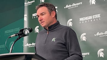 Michigan State head coach Jonathan Smith listens to a question being asked during a press conference on Nov. 10, 2025.