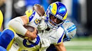 Los Angeles Rams quarterback Matthew Stafford (9) is sacked by Detroit Lions defensive end Levi Onwuzurike (91) 