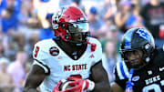 Sep 20, 2025; Durham, North Carolina, USA;  North Carolina State Wolfpack wide receiver Terrell Anderson (9) runs the ball during the second quarter against Duke Blue Devils cornerback Landan Callahan (21) at Wallace Wade Stadium. Mandatory Credit: Zachary Taft-Imagn Images