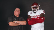 Oklahoma offensive lineman Michael Fasusi and offensive line coach Bill Bedenbaugh
