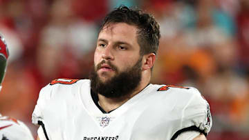 Aug 23, 2024; Tampa, Florida, USA;  Tampa Bay Buccaneers center Robert Hainsey (70) against the Miami Dolphins during the second quarter at Raymond James Stadium. Mandatory Credit: Kim Klement Neitzel-Imagn Images