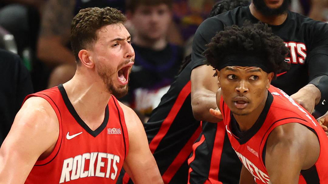 Apr 7, 2026; Phoenix, Arizona, USA; Houston Rockets center Alperen Sengun (28) celebrates a shot by guard Amen Thompson (center) against the Phoenix Suns in the second half at Mortgage Matchup Center. Mandatory Credit: Mark J. Rebilas-Imagn Images
