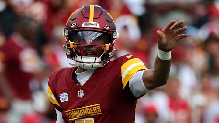 Sep 8, 2024; Tampa, Florida, USA;  Washington Commanders quarterback Jayden Daniels (5) calls a a play against the Tampa Bay Buccaneers during the first half at Raymond James Stadium. Mandatory Credit: Kim Klement Neitzel-Imagn Images