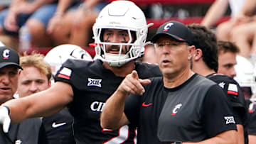 Cincinnati Bearcats head coach Scott Satterfield speaks with players during a NCAA men’s college football game between the Cincinnati Bearcats and Northwestern State Demons, Saturday, Sept. 13, 2025, at Nippert Stadium in Cincinnati.