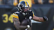 Pittsburgh Steelers running back Jaylen Warren runs with the ball.