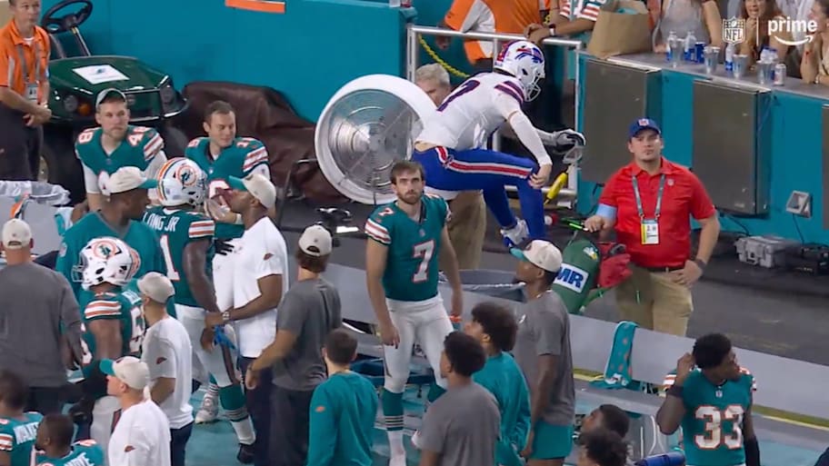 Josh Allen jumping over the Dolphins’ bench while everyone pretends it’s not awesome.