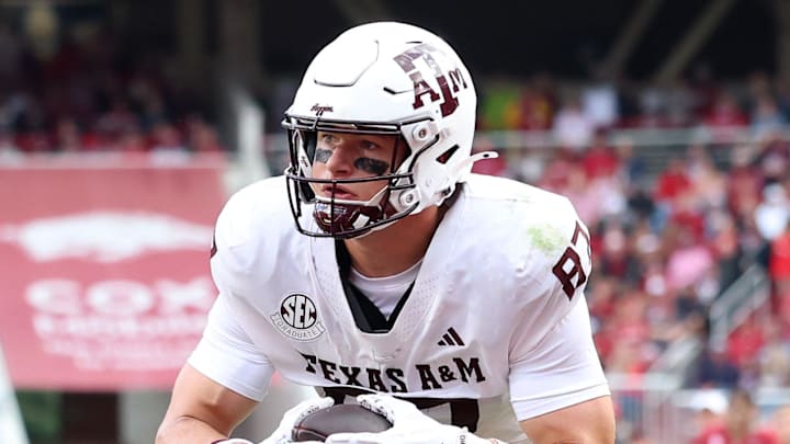 Oct 18, 2025; Fayetteville, Arkansas, USA; Texas A&M Aggies tight end Nate Boerkircher (87) scores a touchdown in the second quarter against the Arkansas Razorbacks at Donald W. Reynolds Razorback Stadium. Mandatory Credit: Nelson Chenault-Imagn Images