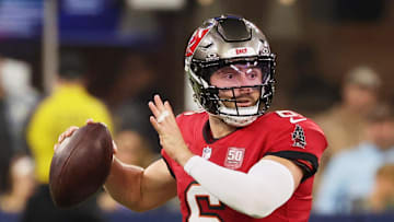 Tampa Bay Buccaneers quarterback Baker Mayfield (6) looks to pass the ball while running outside the pocket against the Los Angeles Rams 