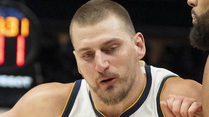 Apr 30, 2026; Minneapolis, Minnesota, USA; Denver Nuggets center Nikola Jokic (15) dribbles the ball as Minnesota Timberwolves center Rudy Gobert (27) played defense in the second half during game six of the first round of the 2026 NBA Playoffs at Target Center. Mandatory Credit: Jesse Johnson-Imagn Images