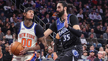 New York Knicks guard Jordan Clarkson drives past Orlando Magic center Goga Bitadze.