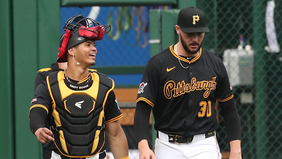 Apr 14, 2025; Pittsburgh, Pennsylvania, USA;  Pittsburgh Pirates catcher Endy Rodriguez (5) and starting pitcher Paul Skenes (30) make their way in from the bullpen to play the Washington Nationals at PNC Park. Mandatory Credit: Charles LeClaire-Imagn Images