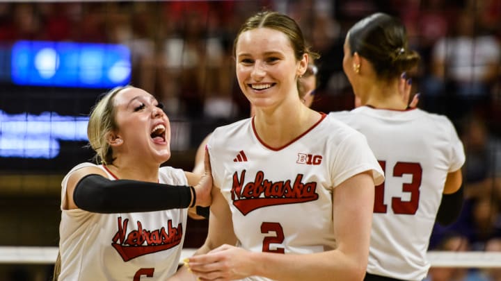 Laney Choboy (6) celebrates an ace from Bergan Reilly (2). 