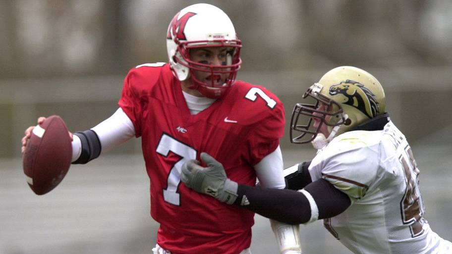 Miami RedHawks quarterback Ben Roethlisberger fights off a sack from a Western Michigan defender.
