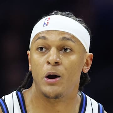 Orlando Magic forward Paolo Banchero dribbles the ball against the Philadelphia 76ers.