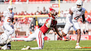 Arkansas Quarterback Taylen Green (10) attempts to throw the ball away against the Texas Longhorns to avoid a sack. The Longhorns won 20-10.