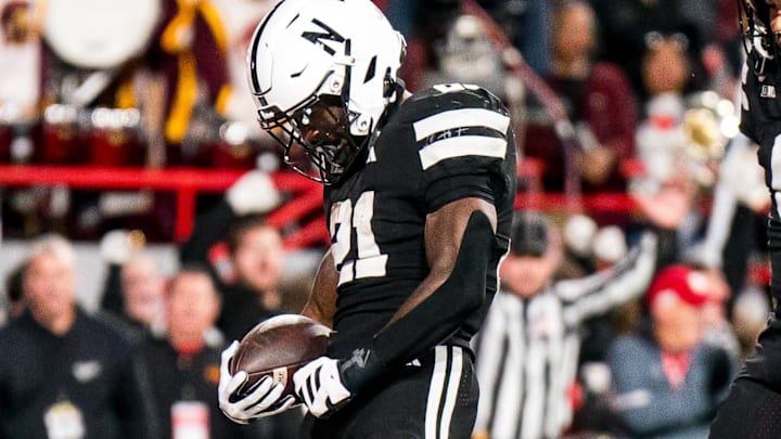 Emmett Johnson celebrates after scoring a touchdown against the Southern California Trojans during the second quarter. Emmett Johnson celebrates after scoring a touchdown against the Southern California Trojans during the second quarter.