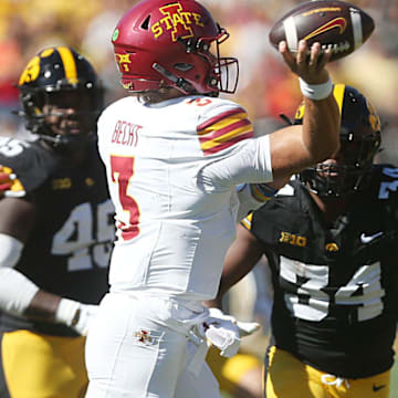 Iowa State Cyclones quarterback Rocco Becht (3) passes the ball around Iowa Hawkeyes's defensive back Jay Higgins (34) during the second quarter in the Cy-Hawk series at Kinnick Stadium on Saturday, Sept. 7, 2024, in Iowa City, Iowa.