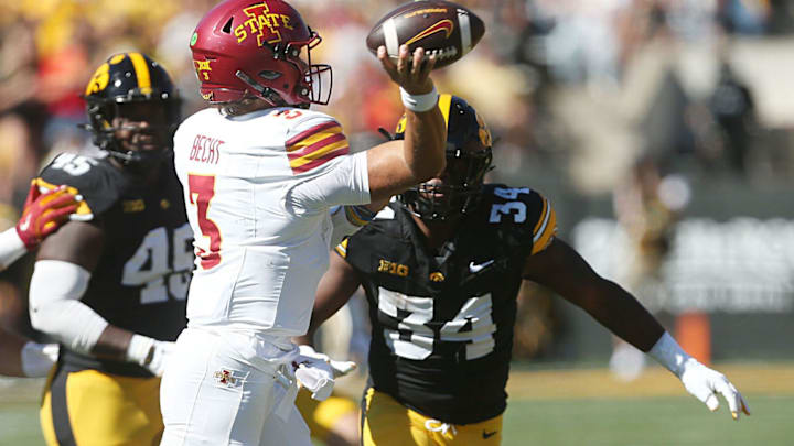 Iowa State Cyclones quarterback Rocco Becht (3) passes the ball around Iowa Hawkeyes's defensive back Jay Higgins (34) during the second quarter in the Cy-Hawk series at Kinnick Stadium on Saturday, Sept. 7, 2024, in Iowa City, Iowa.