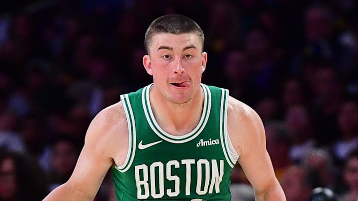 Feb 22, 2026; Los Angeles, California, USA; Boston Celtics guard Payton Pritchard (11) controls the ball against Los Angeles Lakers guard Luke Kennard (10) during the first half at Crypto.com Arena. Mandatory Credit: Gary A. Vasquez-Imagn Images