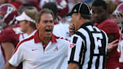 Alabama Coach Nick Saban argues with a referee following a fourth quarter call against Arkansas.
