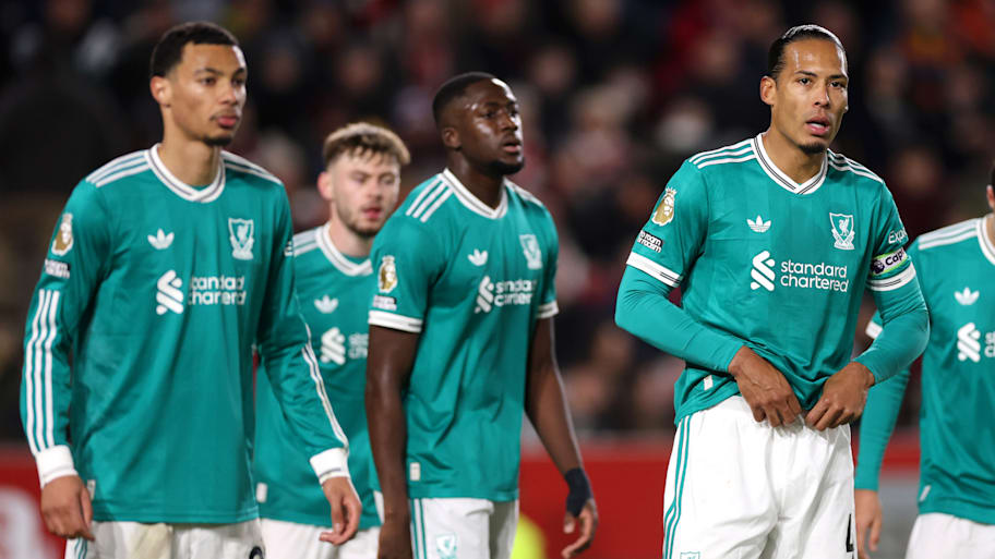 Liverpool players looking dejected.