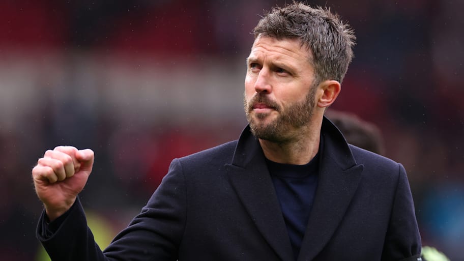 Michael Carrick raising a clenched fist.