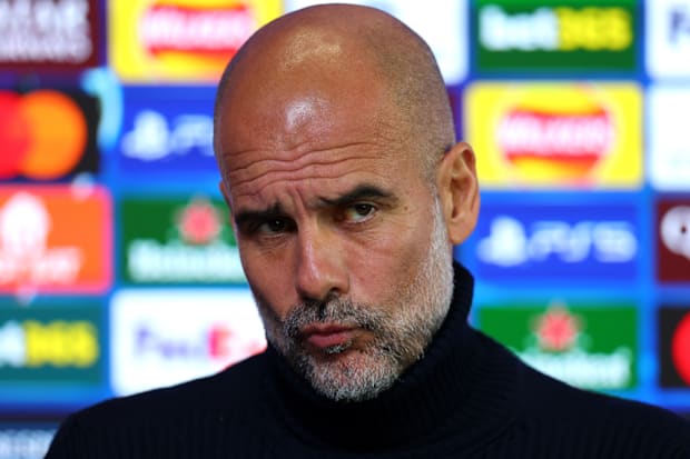 Pep Guardiola making a disappointed expression. Pep Guardiola making a disappointed expression.