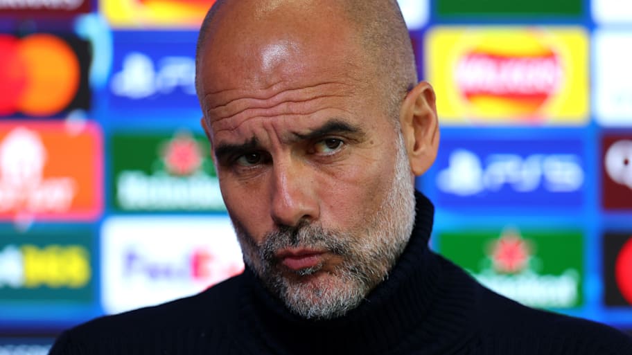 Pep Guardiola pouting.