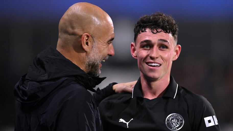 Pep Guardiola (left) and Phil Foden.