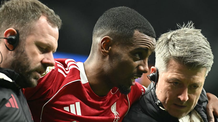 Alexander Isak (centre) being helped off the pitch.