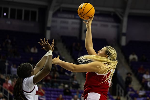 Nebraska center Alexis Markowski (right) shoots the ball against Louisville in the first round of the NCAA Tournament in Fort