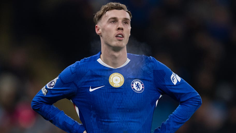 Cole Palmer with hands on hips.