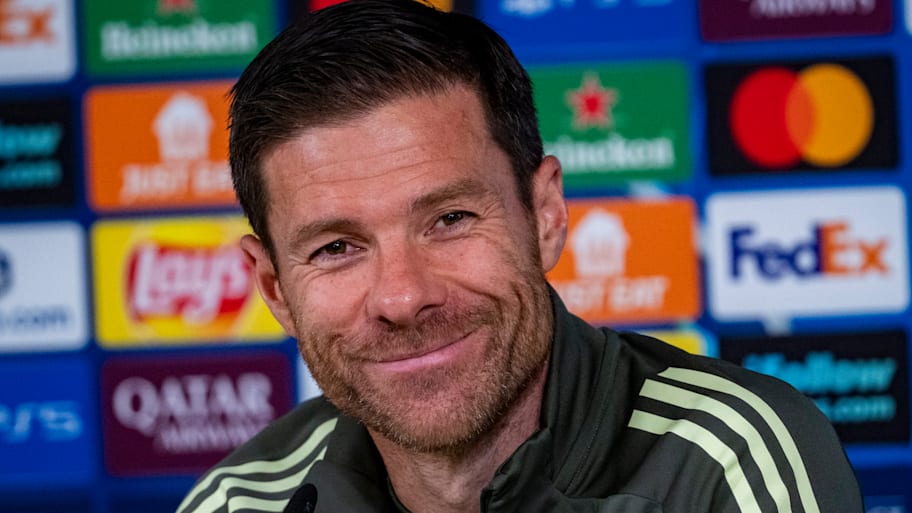 Xabi Alonso grinning like the Cheshire Cat.