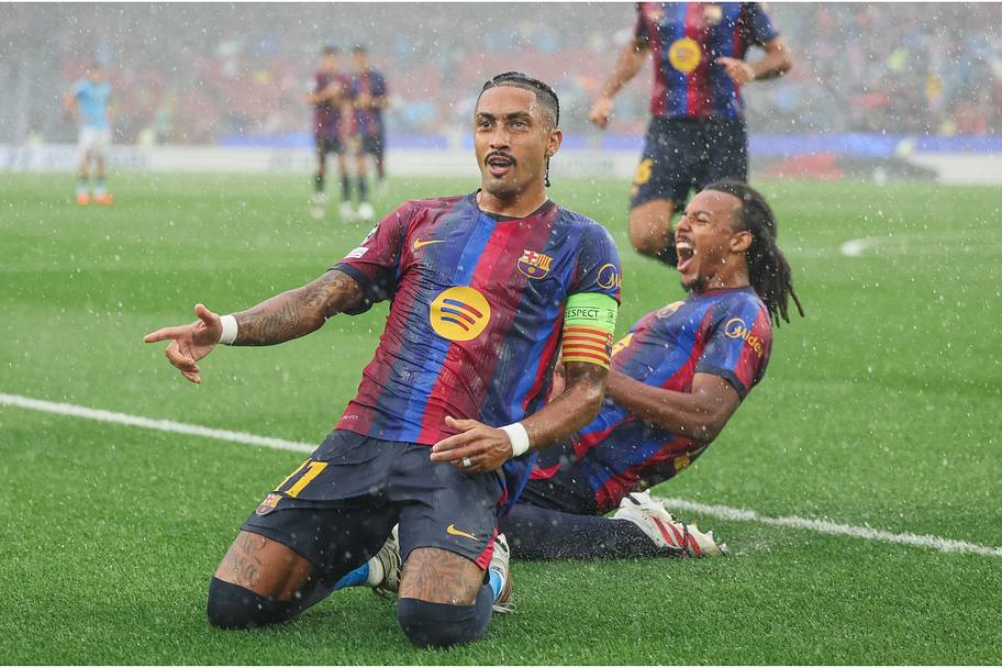 Raphinha celebrates scoring for Barcelona against Feyenoord in the Champions League. 