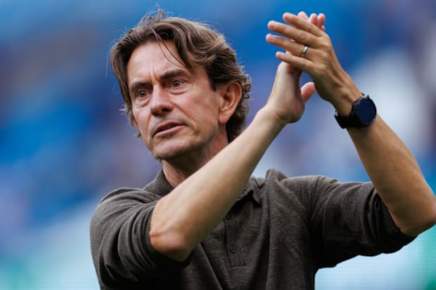 Thomas Frank applauding the travelling Spurs support.