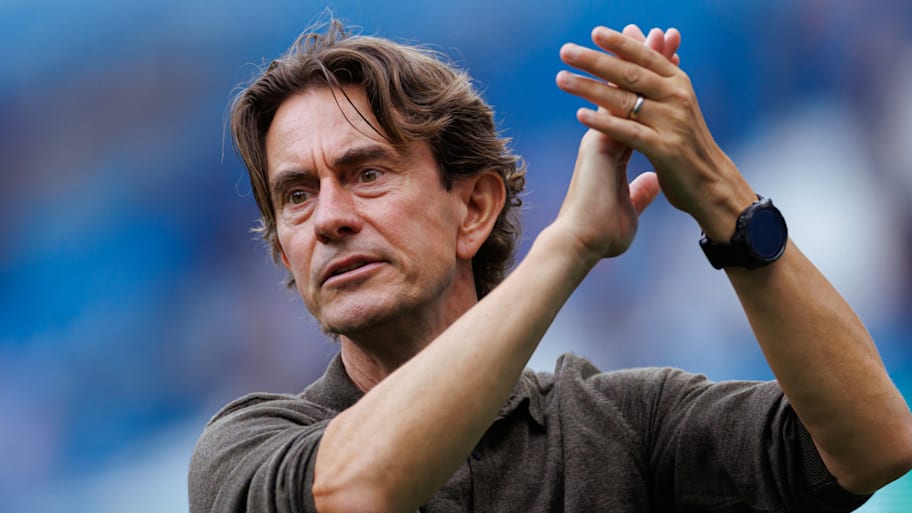 Thomas Frank applauding the travelling Spurs support.