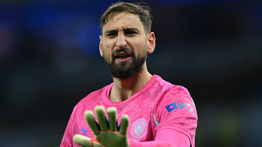 Gianluigi Donnarumma wincing.