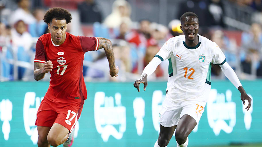 Tajon Buchanan (left) and Mohamed Diomande running.