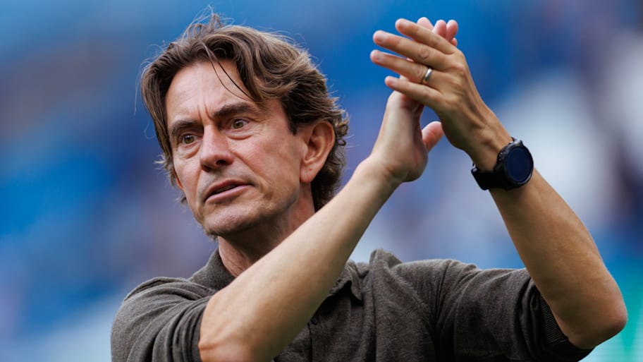 Thomas Frank applauding the travelling Spurs support.
