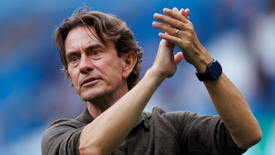 Thomas Frank applauding the travelling Spurs support.