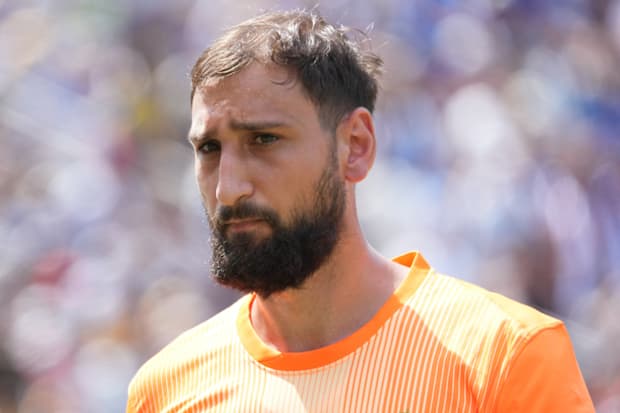Gianluigi Donnarumma looking pained.