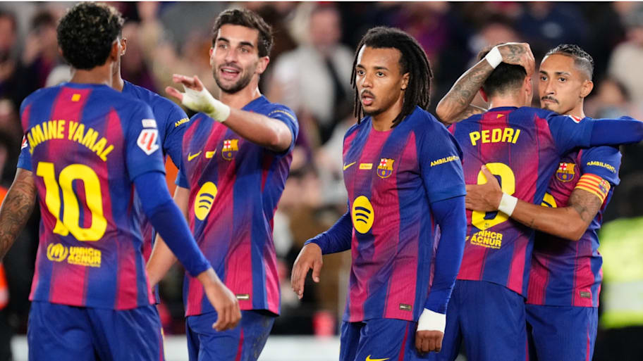 Barcelona’s players celebrate Raphinha’s goal.