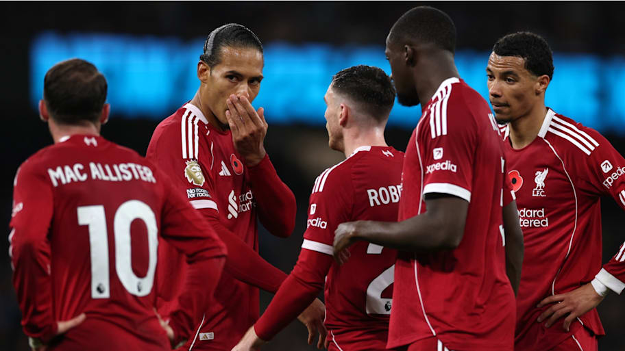 Liverpool’s players look on as Virgil van Dijk communicates a message.