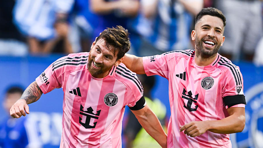 Lionel Messi celebrating with Jordi Alba.