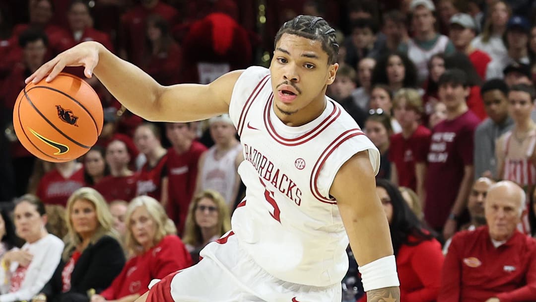 Arkansas Razorbacks guard Darius Acuff Jr (5) dribbles during the first half against the Auburn Tigers at Bud Walton Arena.