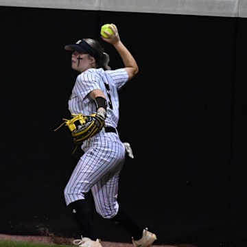 Hernando Tigers Molly Anderson (5) fields a ball at the warning track during game two of the Class 7A MHSAA Softball Championships between Northwest Rankin
and Hernando at the University of Southern Miss Softball Complex in Hattiesburg, Miss., on Thursday, May 16, 2024.