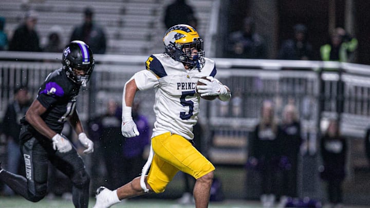 Andrew Beard of Prince Avenue breaks through the middle of Calvary's defense to score a touchdown on Nov. 29, 2024.